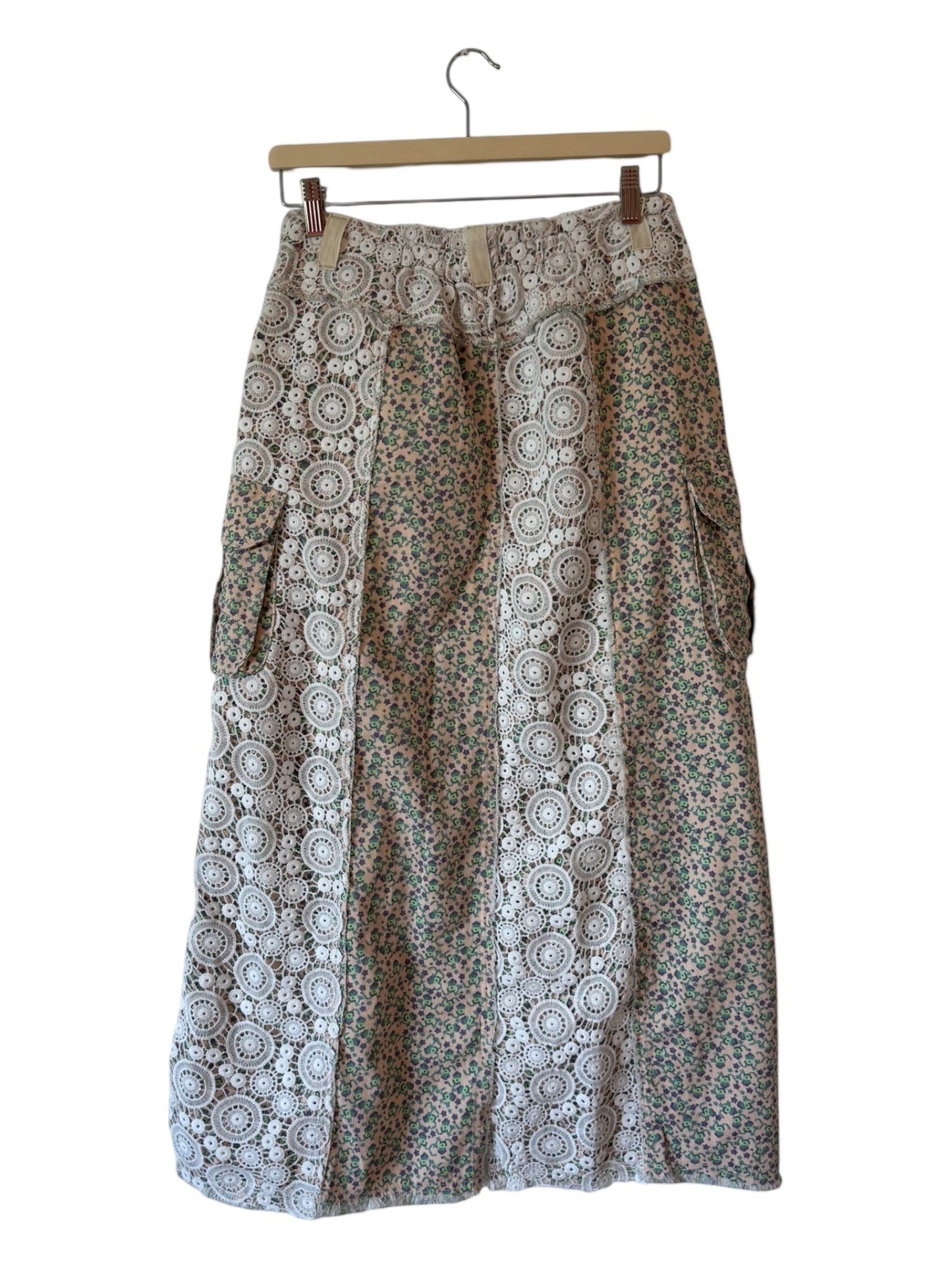 EUKALYPTO boho maxi skirt with patchwork lace and floral print, utility pockets, and textured fabric.