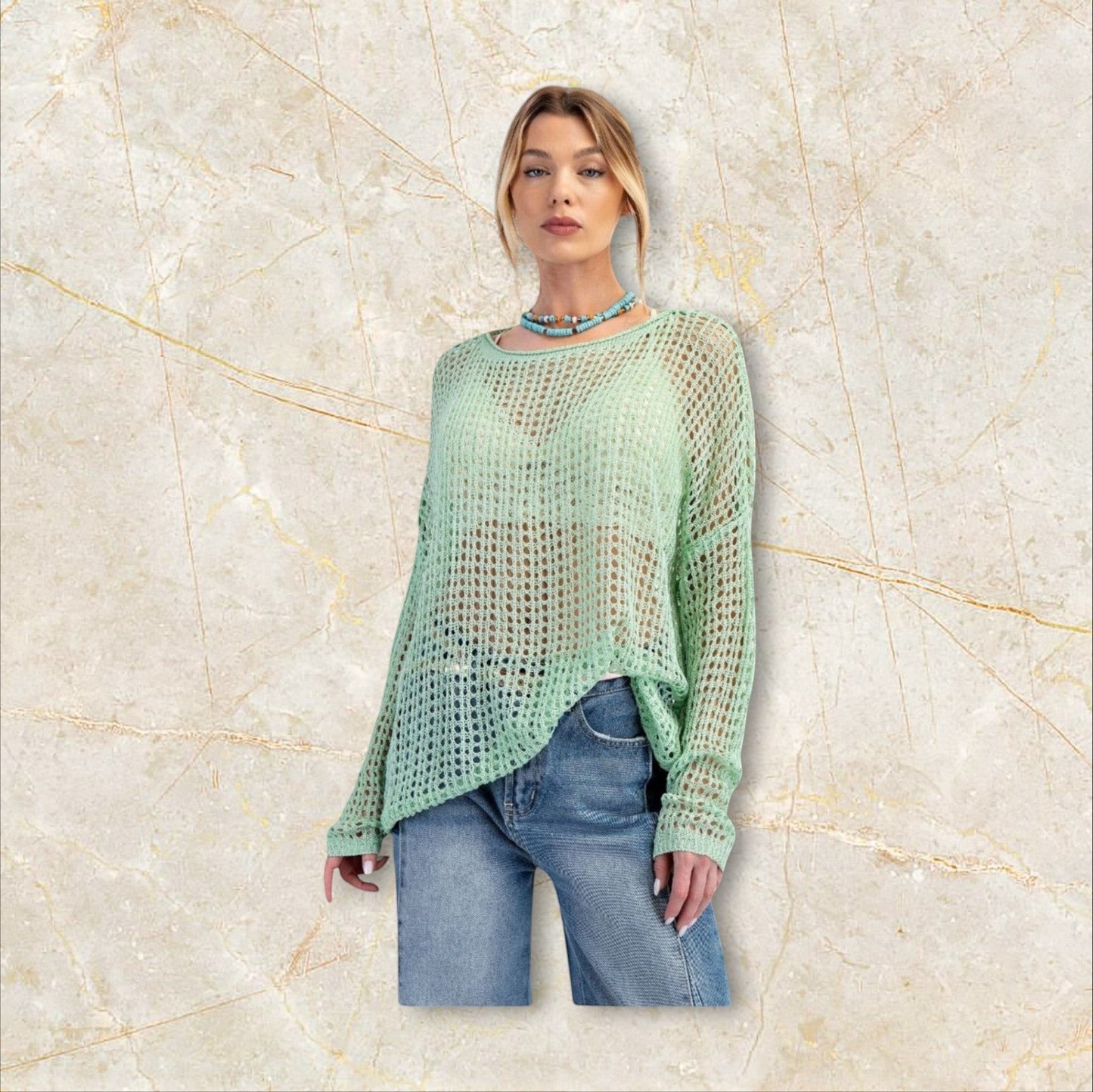 Sage green open knit sweater with relaxed fit, soft drape and effortless bohemian feel. Lightweight layering piece with dropped shoulders and airy texture.