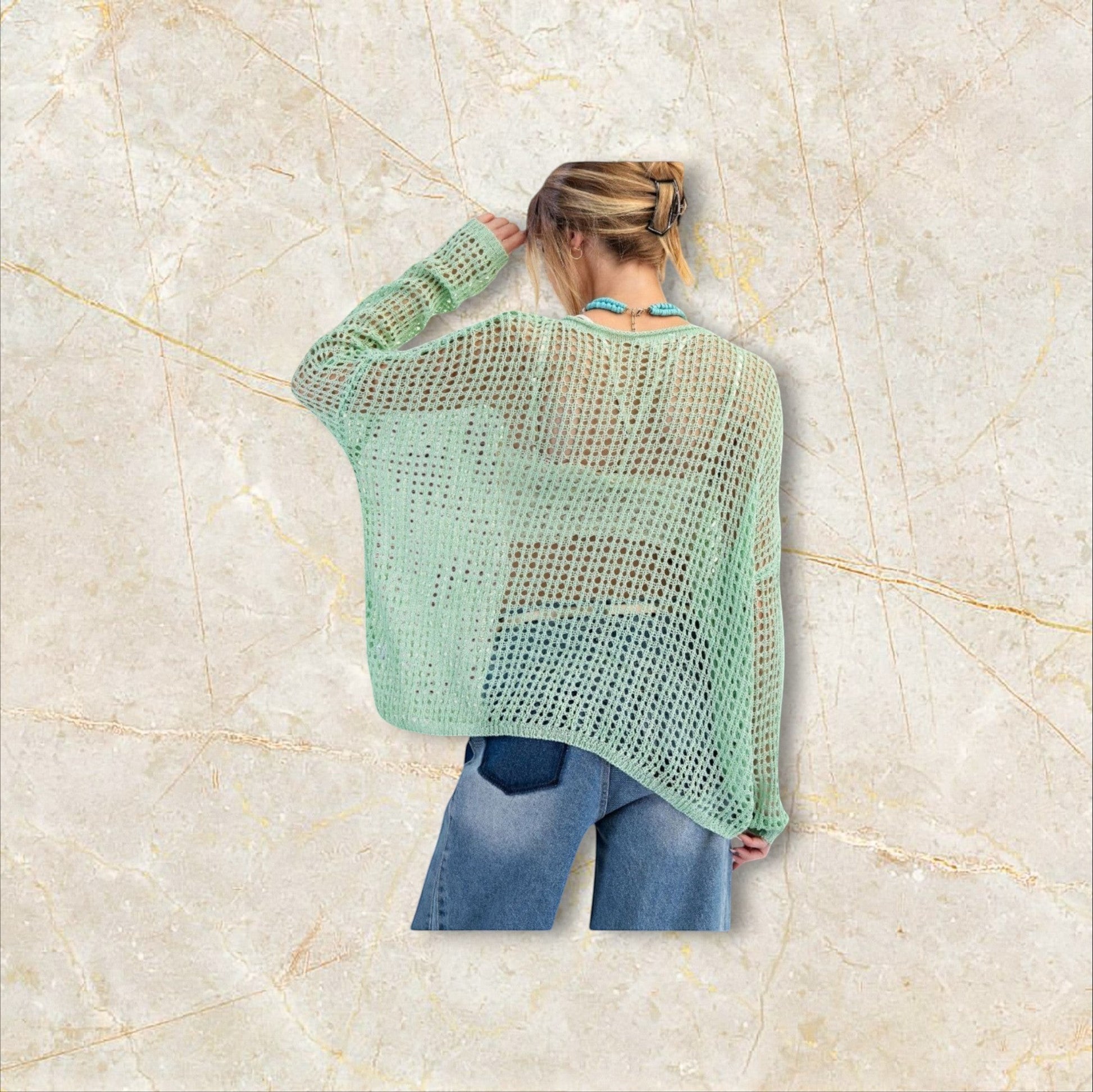 EUKALYPTO sage green open knit sweater with rounded neckline and dropped shoulders. 100% acrylic.