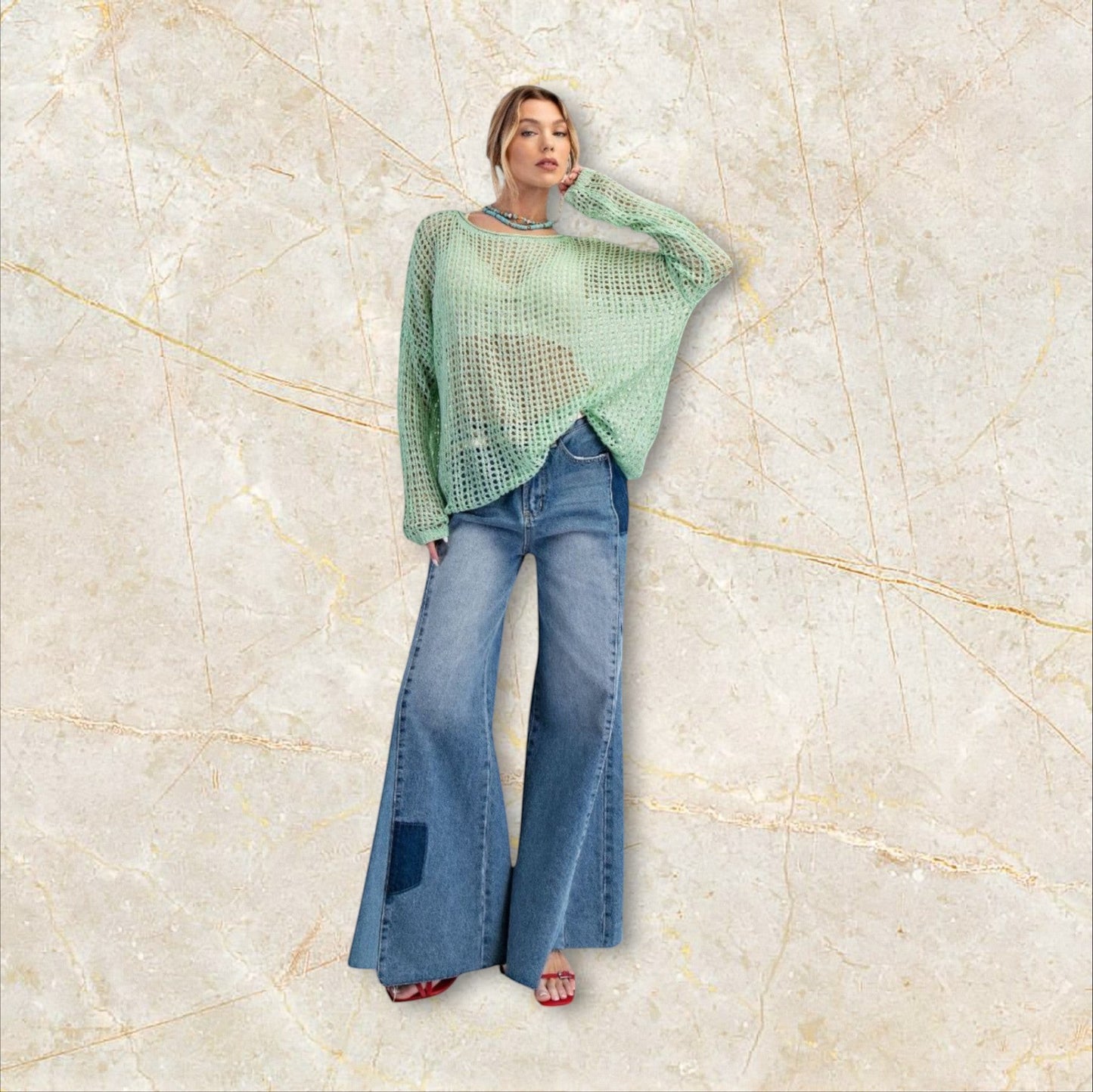 Sage green open knit sweater with relaxed fit, soft drape and effortless bohemian feel. Lightweight layering piece with dropped shoulders and airy texture.